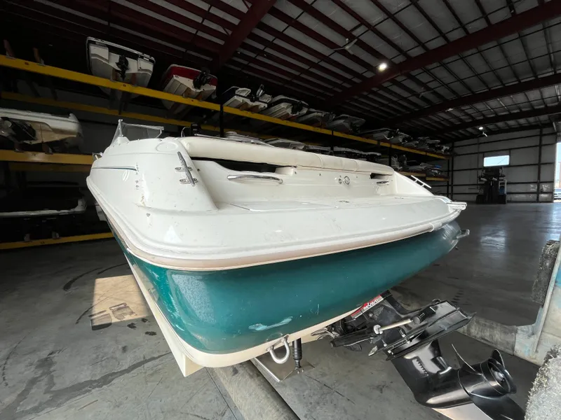 Slide: The Image of 1997 Monterey 236 Montura boat in indoor storage facility. - 3