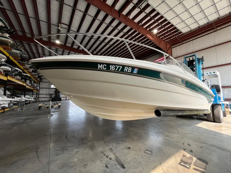 Slide: The Image of 1997 Monterey 236 Montura boat in indoor storage facility. - 4