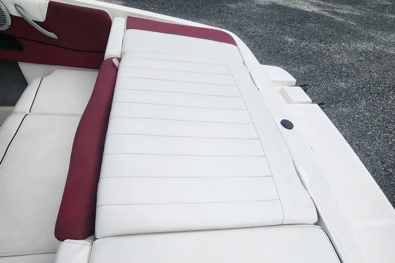 Slide: The Image of 2018 Bayliner 185 Bowrider boat with white and red seating. - 11