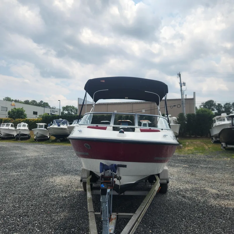 Slide: The Image of 2018 Bayliner 185 Bowrider boat on a trailer in a boatyard. - 5