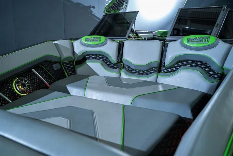 Slide: The Image of 2018 Pavati AL26 boat interior with stylish seating and green accents. - 7