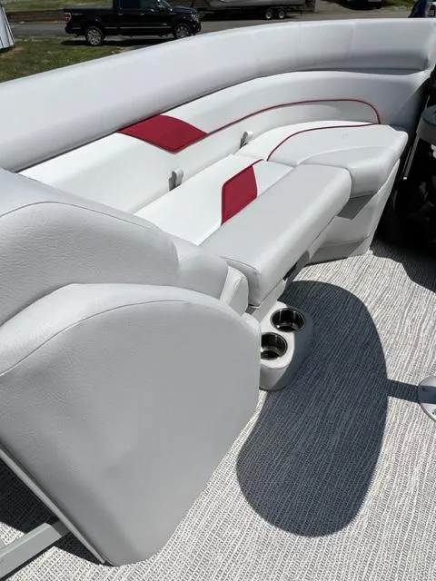 Slide: The Image of 2023 SunCatcher SELECT boat interior with white and red seating. - 9
