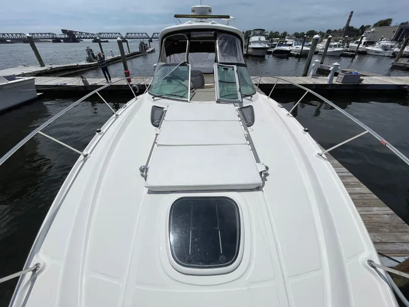 Slide: The Image of 2012 Sea Ray 350 Sundancer yacht docked at a marina. - 12