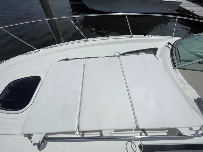 Slide: The Image of 2012 Sea Ray 350 Sundancer bow with sunpad and railing. - 14