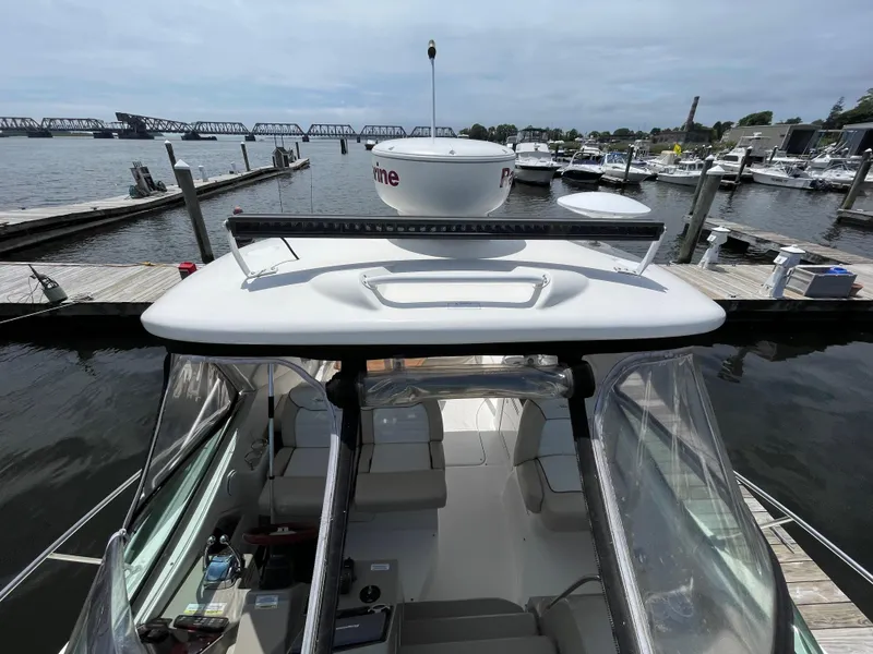 Slide: The Image of 2012 Sea Ray 350 Sundancer docked at a marina with a view of the interior. - 15