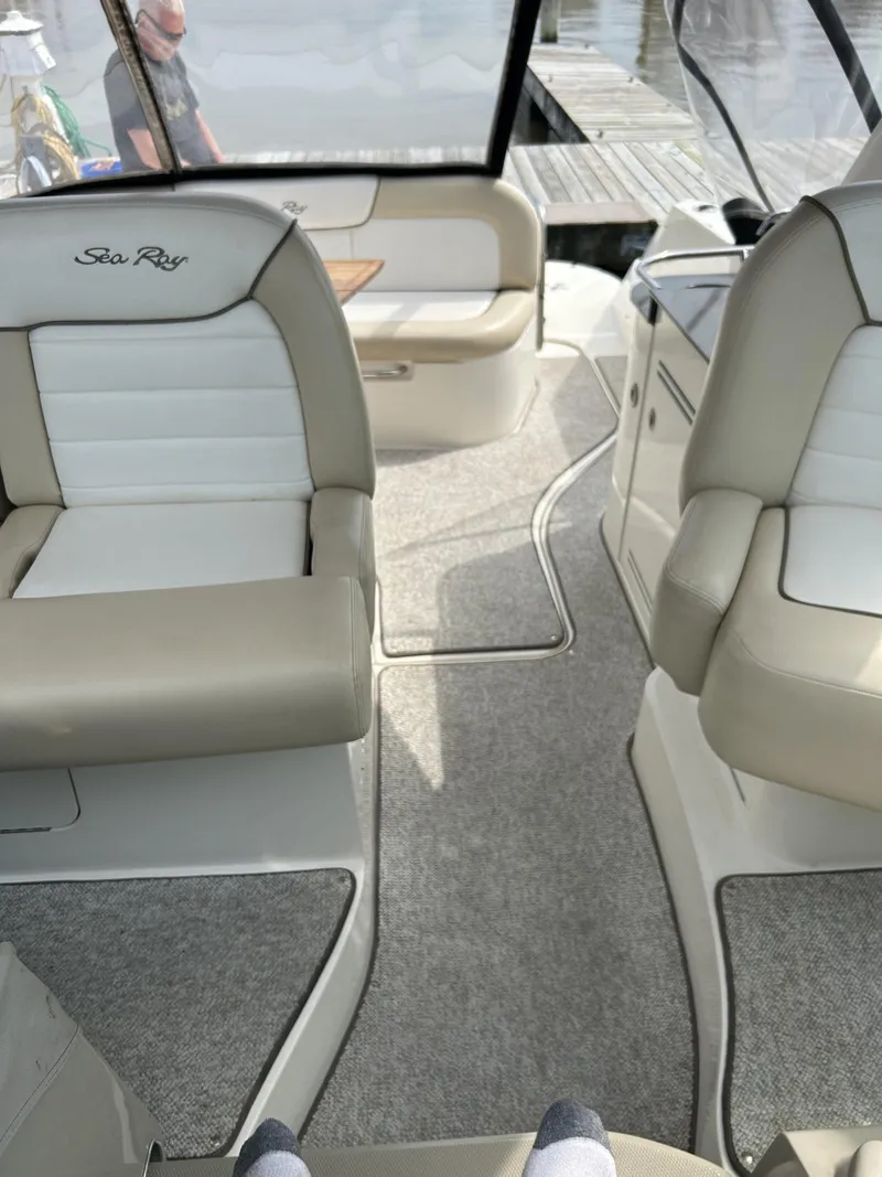 Slide: The Image of Interior of a 2012 Sea Ray 350 Sundancer boat with beige seating. - 6