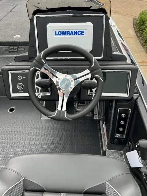 Slide: The Image of 2023 Ranger Z521R boat dashboard with Lowrance electronics and modern steering wheel. - 4