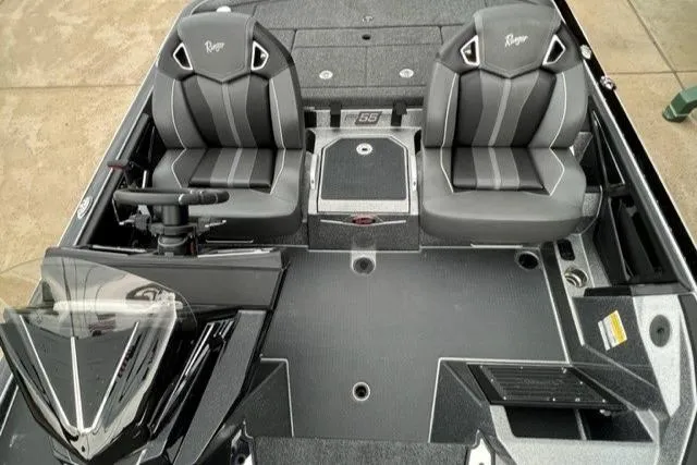 Slide: The Image of 2023 Ranger Z521R boat interior with dual seats and steering console. - 5