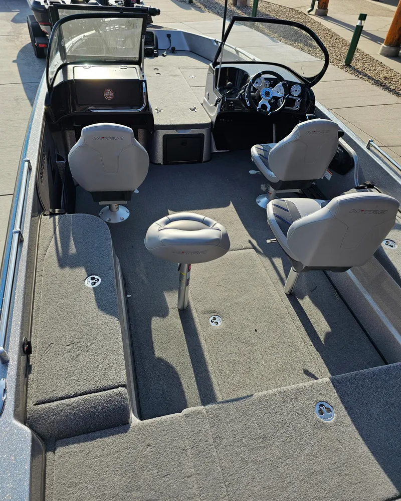 Slide: The Image of 2023 Nitro ZV21 fishing boat interior with seating and steering console. - 3