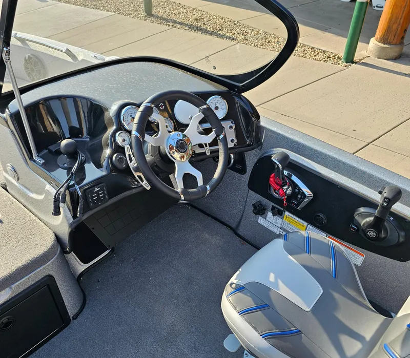 Slide: The Image of 2023 Nitro ZV21 boat cockpit with steering wheel and control panel. - 4