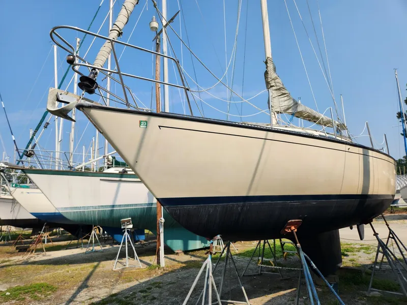 The Image of 1984 S2 9.2 sailboat on stands in a boatyard. - 0