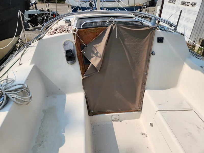 Slide: The Image of 1984 S2 9.2 sailboat cockpit with covered companionway and coiled rope. - 17