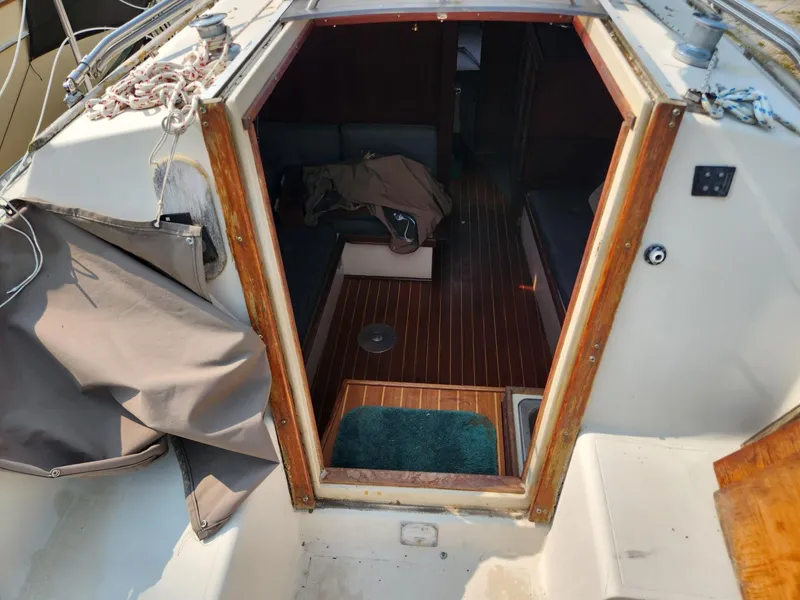 Slide: The Image of 1984 S2 9.2 sailboat interior view from cockpit, showing cabin entrance. - 20