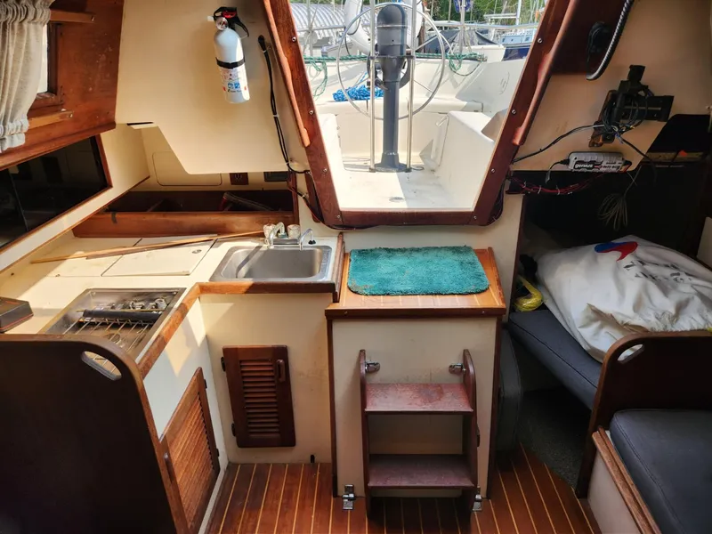 Slide: The Image of Interior of 1984 S2 9.2 sailboat with kitchen, sink, and sleeping area. - 29
