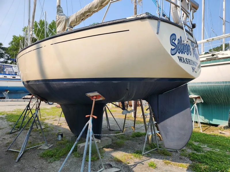 Slide: The Image of 1984 S2 9.2 sailboat on stands for maintenance in a boatyard. - 3