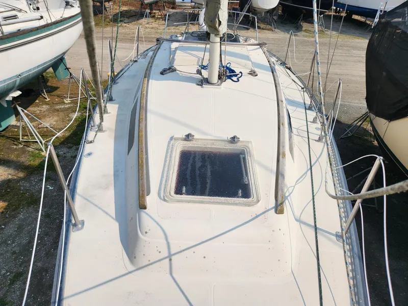 Slide: The Image of 1984 S2 9.2 sailboat deck view with hatch and rigging. - 5
