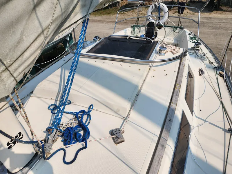 Slide: The Image of 1984 S2 9.2 sailboat deck with rigging and ropes. - 6