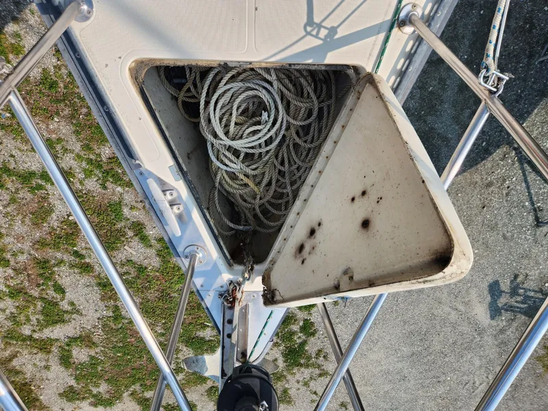 Slide: The Image of Anchor locker of 1984 S2 9.2 sailboat with coiled ropes. - 7