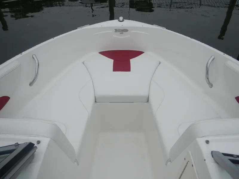 Slide: The Image of 2012 Chaparral 19 H2O Sport boat interior with white and red seating. - 11