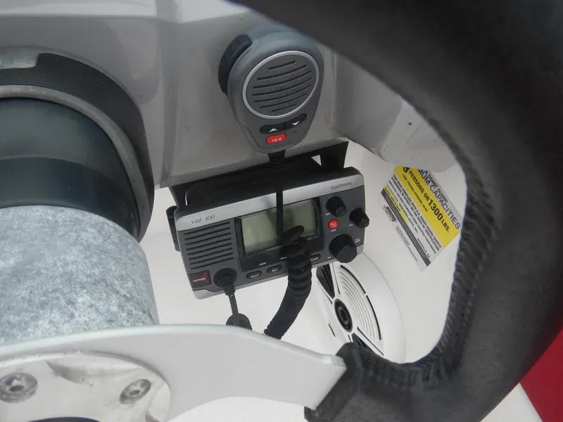 Slide: The Image of VHF radio and microphone on 2012 Chaparral 19 H2O Sport boat dashboard. - 6