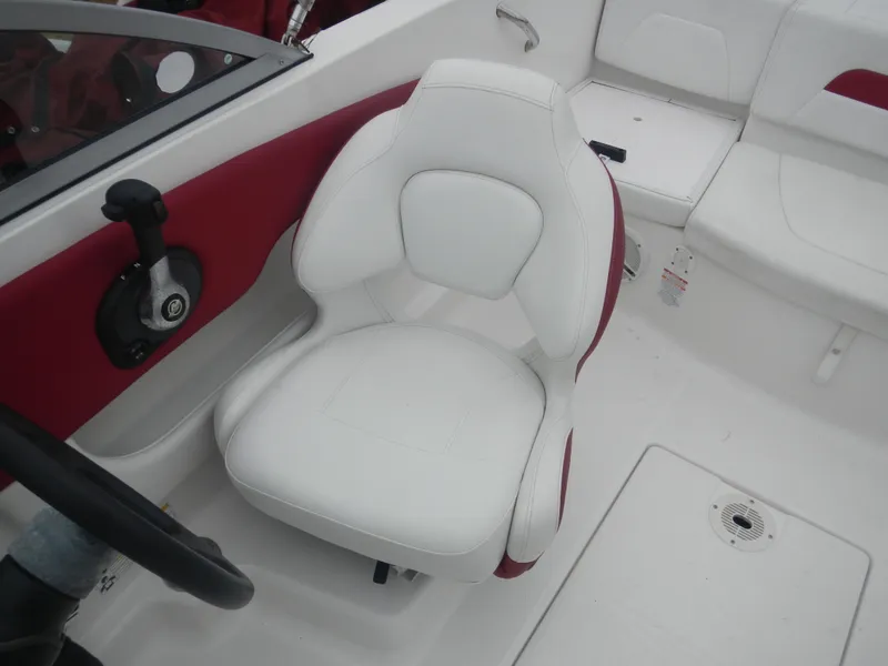 Slide: The Image of 2012 Chaparral 19 H2O Sport boat interior with white and red seating. - 8