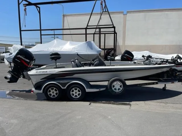 The Image of 2004 Ranger 520 VX/VS boat on trailer outdoors. - 0