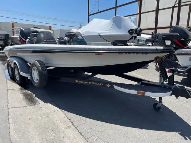 Slide: The Image of 2004 Ranger 520 VX/VS boat parked on trailer outdoors. - 7
