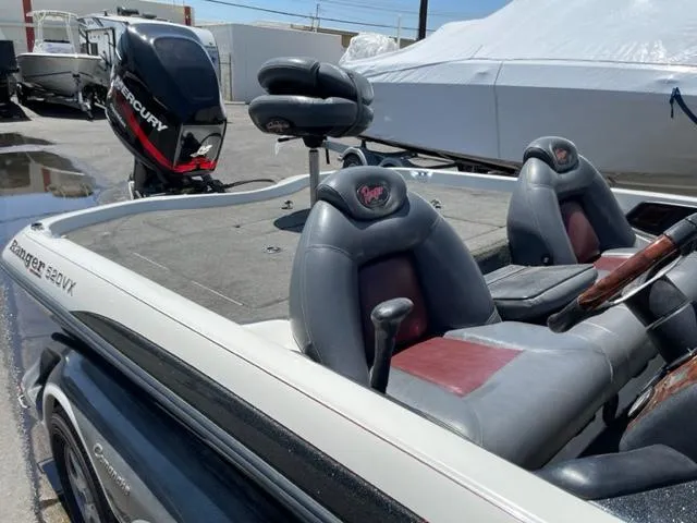 Slide: The Image of 2004 Ranger 520 VX/VS boat with Mercury engine, gray seats. - 8