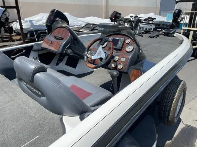 Slide: The Image of Interior of a 2004 Ranger 520 VX/VS boat with steering console. - 9