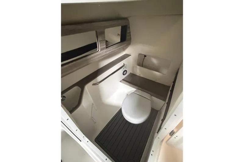 Slide: The Image of 2024 Edgewater 248CX Crossover boat interior with modern bathroom amenities. - 13