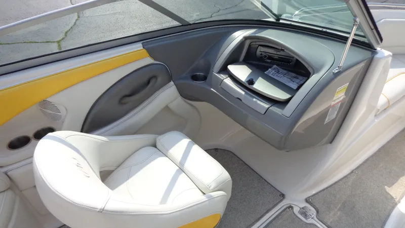 Slide: The Image of 2007 Monterey 214 FS boat interior with white and yellow seating. - 12