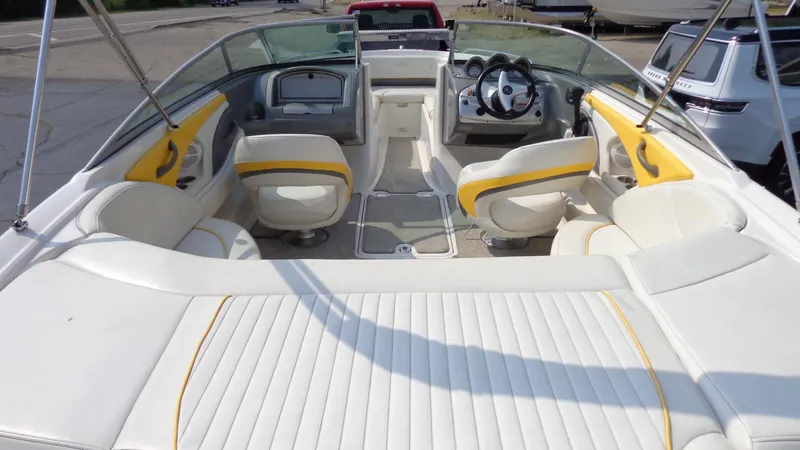 Slide: The Image of 2007 Monterey 214 FS boat interior with white and yellow seating. - 4