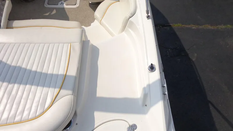 Slide: The Image of 2007 Monterey 214 FS boat interior with white seating and deck. - 5