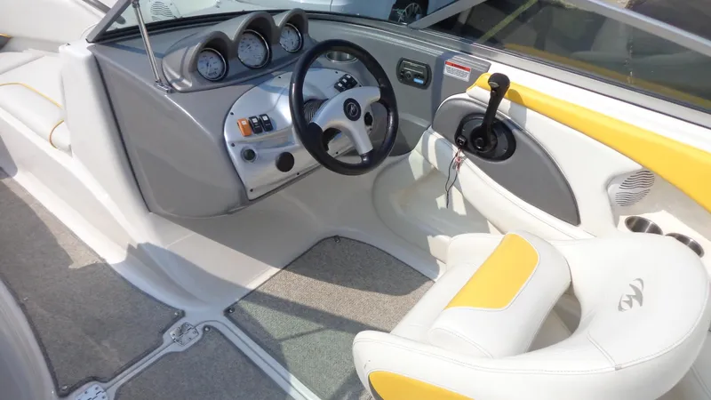 Slide: The Image of 2007 Monterey 214 FS boat cockpit with steering wheel and control panel. - 6