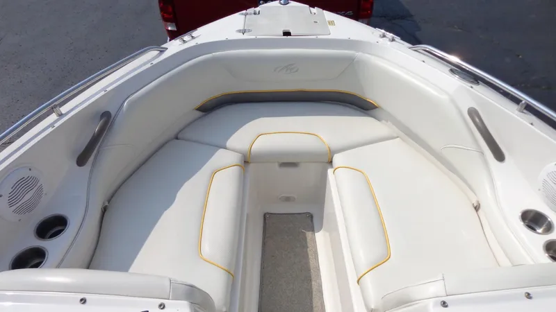 Slide: The Image of 2007 Monterey 214 FS boat with white cushioned seating area. - 9
