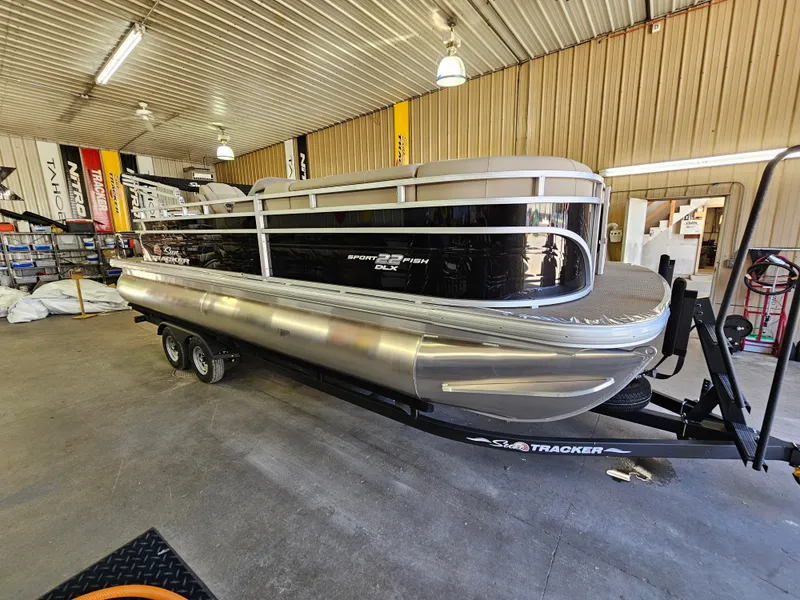 Slide: The Image of 2023 Sun Tracker SportFish 22 XP3 pontoon boat in a showroom. - 3