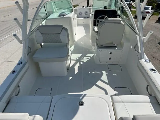 Slide: The Image of 2023 World Cat 230 DC boat interior with seating and helm station. - 3