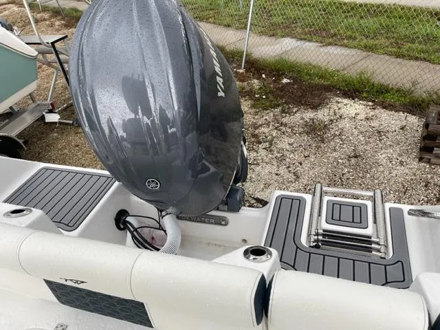 Slide: The Image of 2024 Tidewater 210 LXF boat with Yamaha outboard motor, rear deck view. - 16