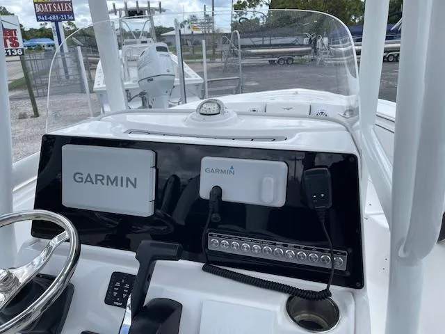 Slide: The Image of 2024 Tidewater 210 LXF boat dashboard with Garmin navigation system. - 17