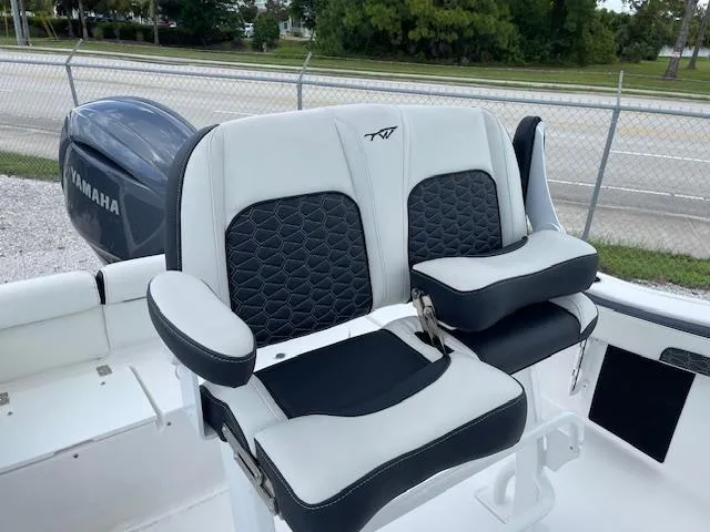 Slide: The Image of 2024 Tidewater 210 LXF boat seats with Yamaha engine in background. - 19