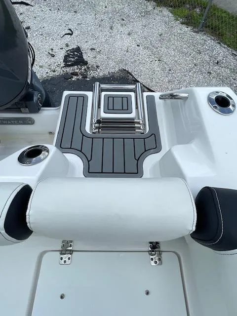 Slide: The Image of 2024 Tidewater 210 LXF boat deck with seating and cup holders. - 24