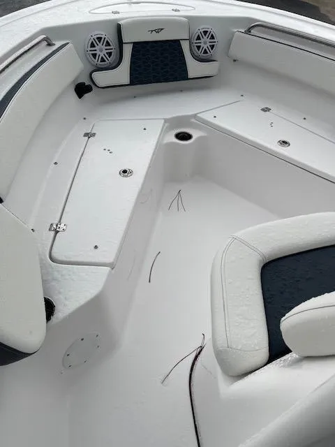 Slide: The Image of 2024 Tidewater 210 LXF boat interior with seating and storage compartments. - 7