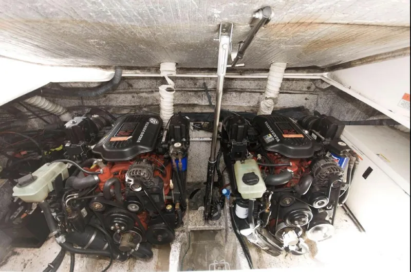 Slide: The Image of 2006 Rinker 342 Express Cruiser engine compartment with dual engines. - 15