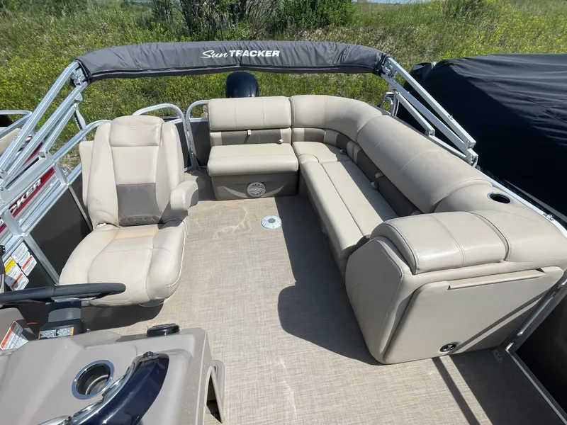 Slide: The Image of 2021 Sun Tracker Party Barge 20 DLX pontoon boat with beige seating and spacious deck. - 6