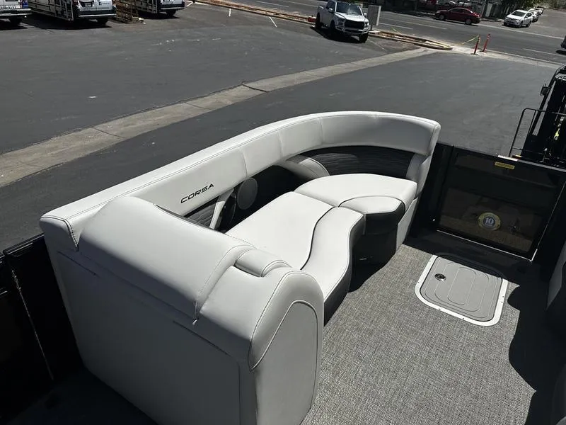 Slide: The Image of 2023 Barletta 23UA boat with luxurious white seating and spacious deck. - 16