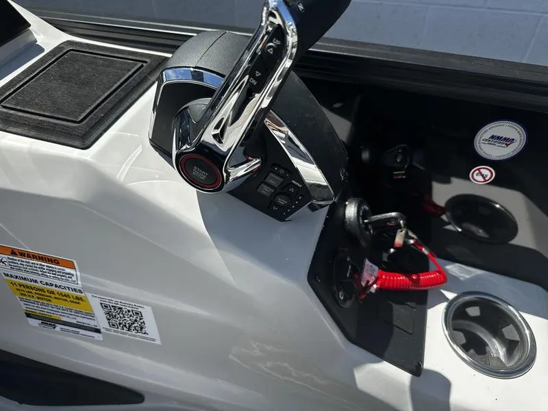 Slide: The Image of 2023 Barletta 23UA boat control panel with throttle and safety features. - 19