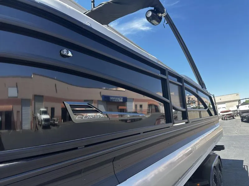 Slide: The Image of 2023 Barletta 23UA boat exterior with sleek black finish. - 4