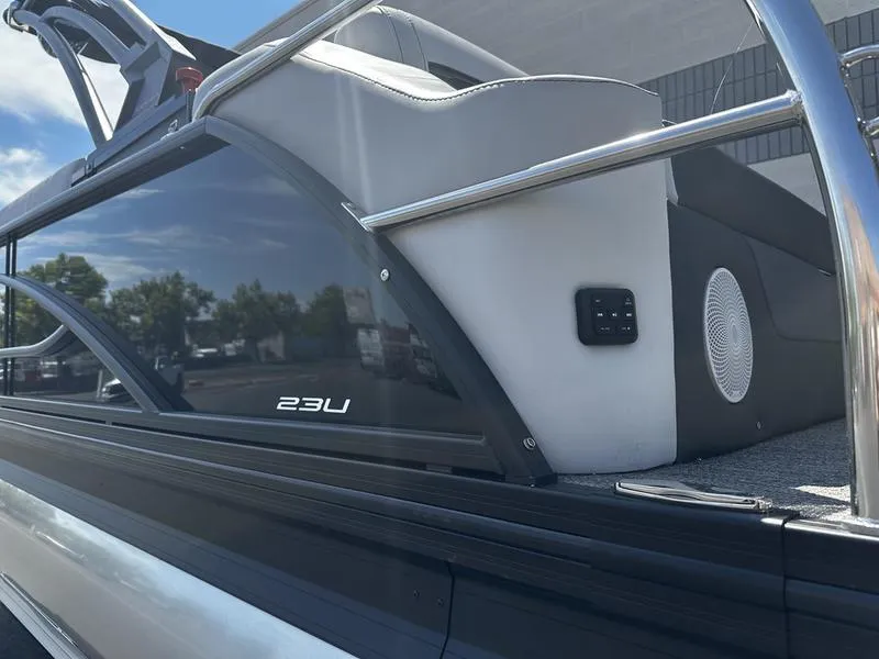 Slide: The Image of 2023 Barletta 23UA boat side view with sleek design and modern features. - 6