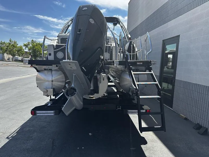 Slide: The Image of 2023 Barletta 23UA pontoon boat rear view with outboard motor and ladder. - 8