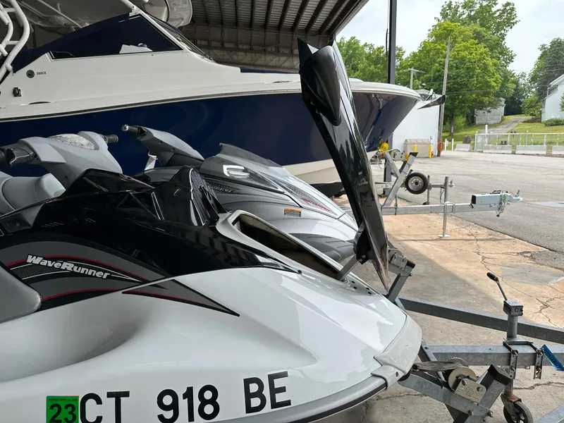 Slide: The Image of 2009 Yamaha WaveRunner FX Cruiser H/O jet skis on trailer in marina. - 19
